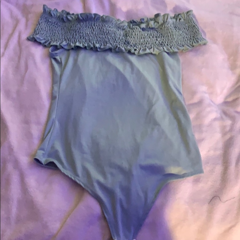 Light green bodysuit off the shoulder